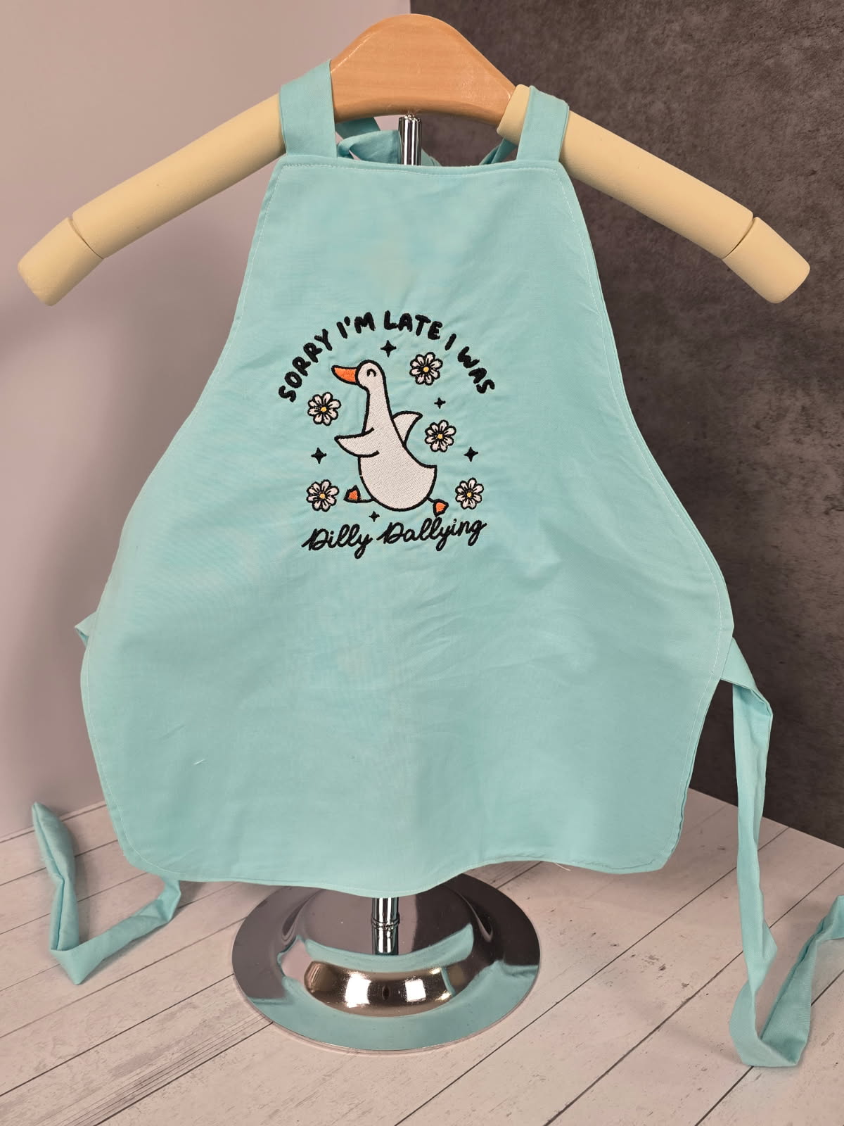 Dilly dallying light blue apron